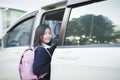 Asian girl in student uniform going to school by car Royalty Free Stock Photo