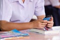 Asian girl student use smart phone in school Royalty Free Stock Photo