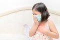 Asian girl suffer from cough with face mask protection Royalty Free Stock Photo