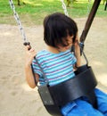 Asian girl on swing Royalty Free Stock Photo