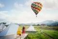 Asian girl take a hot air balloon photo by camera in Countryside homestay Royalty Free Stock Photo