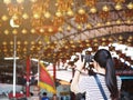 Asian girl taking photograph the lamp from mobile phone