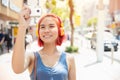 Asian girl teen happy smile to travel with camera take a photo around the city outdoor summer season Royalty Free Stock Photo