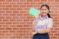 Asian girl teen student uniform happy smiling portrait with book for education back to school concept Royalty Free Stock Photo
