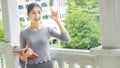 asian girl thinks an idea with red book