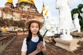 Asian girl tourist holding a lotus with respecting or pray at Wa Royalty Free Stock Photo