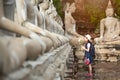 Asian girl tourist holding a lotus with respecting or pray Royalty Free Stock Photo