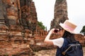 Asian girl tourist taking photo of ancient of pagoda temple Royalty Free Stock Photo