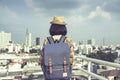 Asian girl tourists stand to admire the beauty of the building. and landscape of Bangkok, Thailand. during his vacation trip