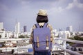 Asian girl tourists stand to admire the beauty of the building. and landscape of Bangkok, Thailand. during his vacation trip