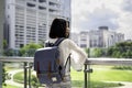 Asian girl tourists Traveling backpackers stand to admire the beauty of the building. and landscape of Bangkok, Thailand. during