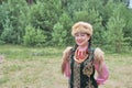 Asian girl in traditional festive Bashkir clothes at rural holiday.
