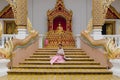 Asian Girl in traditional Thai costume at Wat Phra Singh temple in Chiang Mai Royalty Free Stock Photo