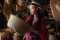 Asian girl, travel and shopping in traditional basketry shop