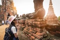 Asian girl traveler with respecting or pray Royalty Free Stock Photo