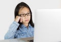 Asian girl is using a laptop on white background Royalty Free Stock Photo