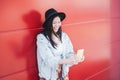 Asian girl using mobile phone outdoor - Happy millennial Chinese woman having fun with new trends smartphone apps Royalty Free Stock Photo