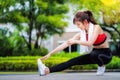 Asian girl warm up brfore running in a park in her village