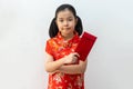 Asian girl wear cheongsam and take Red envelopes in chinese new year Royalty Free Stock Photo