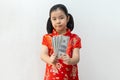 Asian girl wear cheongsam and take Red envelopes in chinese new year Royalty Free Stock Photo