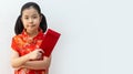 Asian girl wear cheongsam and take Red envelopes in chinese new year Royalty Free Stock Photo