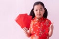 Asian girl wear cheongsam and take Red envelopes in chinese new year Royalty Free Stock Photo