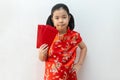 Asian girl wear cheongsam and take Red envelopes in chinese new year Royalty Free Stock Photo