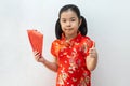 Asian girl wear cheongsam and take Red envelopes in chinese new year Royalty Free Stock Photo