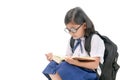 Asian girl wear eyeglasses reading book isolated Royalty Free Stock Photo