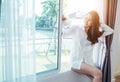 Asian girl who just wake up in the morning as relaxed. Royalty Free Stock Photo