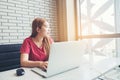 Asian girl working at coffee shop with a laptop.female freelan