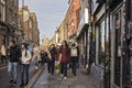 Asian girls with bouquets of flowers walk along Brick Lane Royalty Free Stock Photo