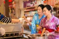 Asian girls hand of dessert during festival event