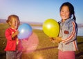Asian Girls Playing Lake Balloon Rural Mongolian Concept