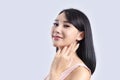 Beautiful young asian girl presenting your product Royalty Free Stock Photo