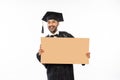 Asian graduate male students wearing toga holding blank space carton Royalty Free Stock Photo