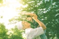 Asian Grandfather and his granddaughter playing outdoors