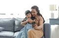 Asian grandmother happy using smartphone taking a selfie photo granddaughter together in the living room Royalty Free Stock Photo