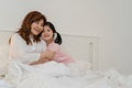 Asian grandmother relax at home. Senior Chinese, grandma happy relax with young granddaughter girl enjoy close her eyes surprise Royalty Free Stock Photo