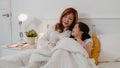 Asian grandmother using tablet read fairy tales to granddaughter at home. Senior Chinese, grandma happy relax with young girl Royalty Free Stock Photo