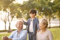 Asian grandparents enjoying good time with grandson Royalty Free Stock Photo