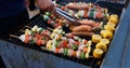 Asian group of friends having outdoor garden barbecue laughing with alcoholic beer drinks on night Royalty Free Stock Photo