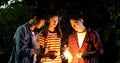 Asian group of friends having outdoor garden barbecue laughing w Royalty Free Stock Photo