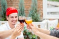 Asian group people drinking at party outdoor. group of friends cocktails in hand with glasses.close up