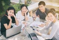 Asian Group of students smiling and sharing with the ideas for w Royalty Free Stock Photo