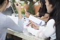 Asian Group of students using tablet and notebook sharing with t Royalty Free Stock Photo