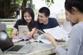 Asian Group of students using tablet and notebook sharing with t Royalty Free Stock Photo