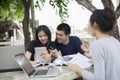 Asian Group of students using tablet and notebook sharing with t Royalty Free Stock Photo