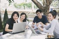 Asian Group of students using tablet and notebook sharing with t Royalty Free Stock Photo