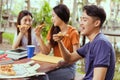 Asian group together eating pizza in breaking time Royalty Free Stock Photo